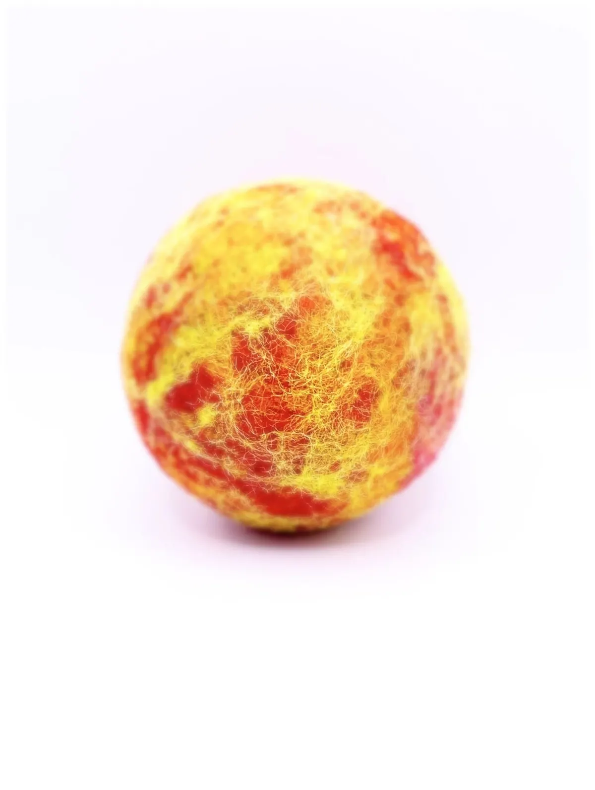 The felted Sun on its own, mottled in red, orange and yellow.